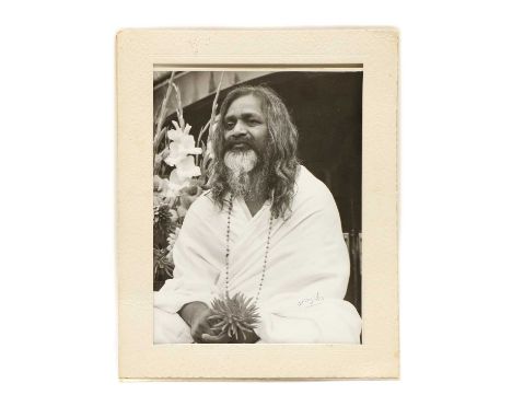 Maharishi Mahesh Yogi, a portrait photograph, signed, stamped to reverse 'Miss D.E Wright, St Albans and numbered 253', 21 x 