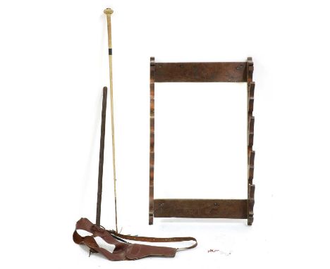 A ropework riding crop, together with a leather swagger stick and gun holster and an oak crop holderCondition report: General