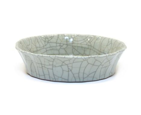 A Chinese ge-type dish, with low lobed flaring sides moulded below a rounded and everted rim, covered in a thick greyish-crea