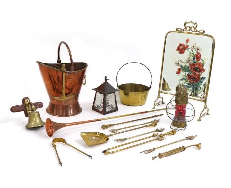 Copper and brassware including a copper coal scuttle with a brass rim and ring handle, 43cm high, an Art Nouveau brass fire s