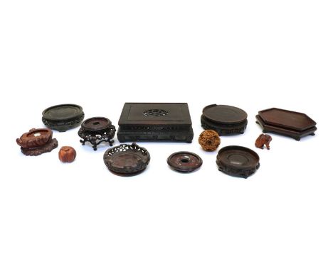 A collection of Chinese wood stands, 5.5-23cm, two Japanese carved wood netsukes, one of a tiger, 4.5cm high and the other of