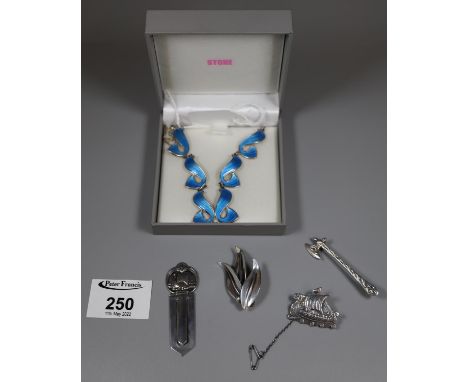 A Norway silver necklace with blue guilloche enamel links. Together with an N E From Danish silver leaf brooc, an 830 silver,