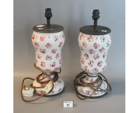 Pair of floral decorated ceramic baluster shaped electric table lamp bases. 30cm high approx. (2)(B. P. 21% + VAT) 