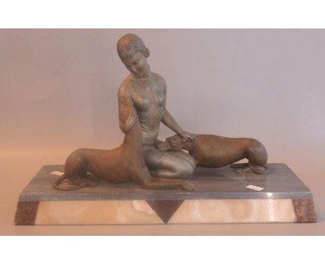 Art Deco spelter portrait group of a woman with two Greyhounds on a coloured marble rectangular base. 256cm high approx.(B.P.