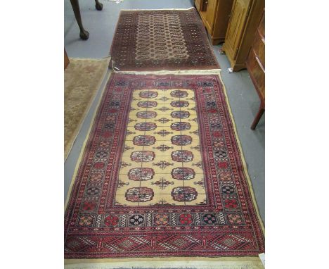 2 Similar middle eastern design rugs with central medallion designs, together with another beige ground floral and foliate Af