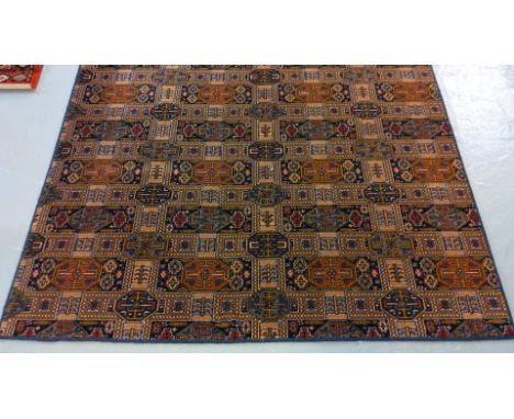 Modern middle eastern design carpet on a multicoloured geometric and foliate ground. 410x172cm approx (B.P. 21% + VAT)