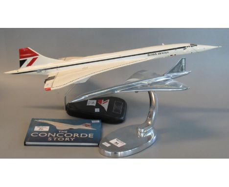 Aluminium desk top model of Concorde on stand, by Nauticalia of London. 42cm long approx. Together with another model of Conc