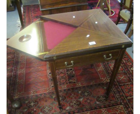 Edwardian mahogany inlaid folding envelope card table on square tapering legs and castors.    (B.P. 21% + VAT) 