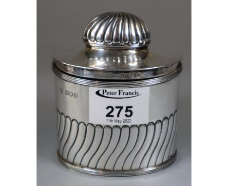Georgian style silver fluted tea caddy of oval form by Herbert C Lambert, Coventry Street, London. Early 20th century. 5.4oz 