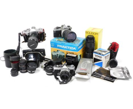 A Nikon camera, with 72mm sky lens, Praktica LTL3 camera, Olympus OM-2 camera, additional lenses, and accessories. (a quantit