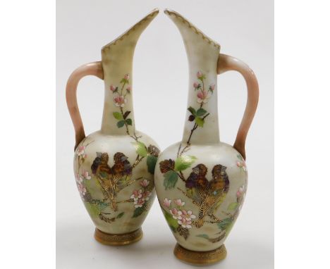A pair of late 19thC Continental milk glass jugs, enamel decorated with birds and blossom, 32cm high.