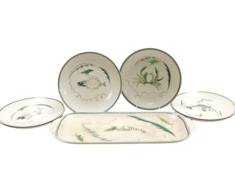 A late 20thC Poole pottery fish service, decorated with fish, a crayfish, crab, snail and shells, comprising an oval dish and