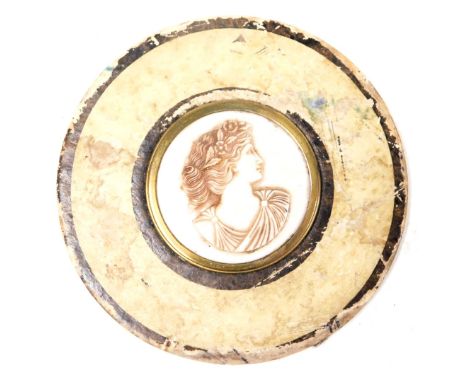 A late 19thC Continental shell cameo, bust portrait of a classical lady, within a brass frame, on a cardboard backing with la