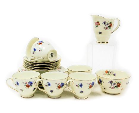 A Royal Doulton porcelain Trixy pattern part tea service, comprising bread plate, cream jug and sugar bowl, six teacups, sauc