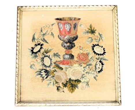 A Victorian beadwork and tapestry picture, of a chalice, within a wreath of roses and other flowers, framed and glazed, 46.5c