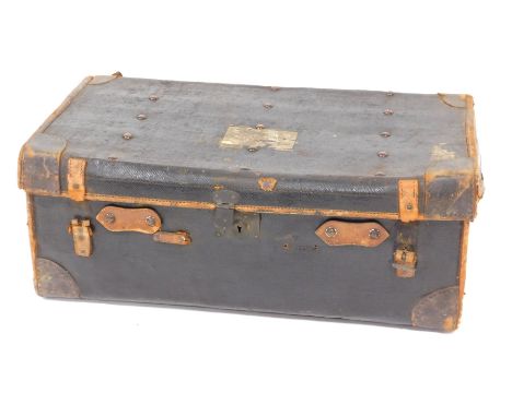 An early 20thC leather bound travel trunk, by JE Bennett of Sheffield, 77cm wide. 