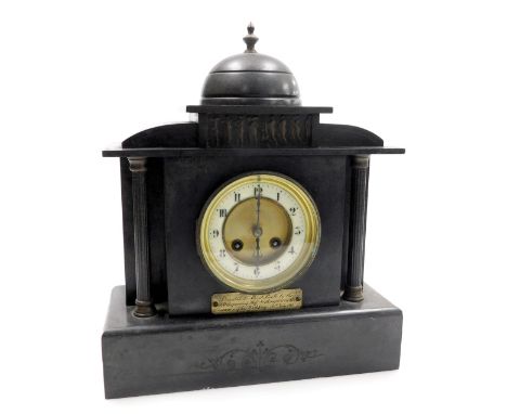 A 19thC French slate mantel clock, the circular brass dial with enamel chapter ring bearing Arabic numerals, eight day moveme