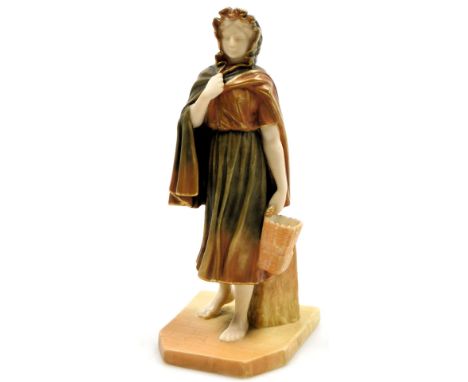 A Royal Worcester blush porcelain figure of a girl, c1898, modelled standing holding a basket, raised on a canted rectangular