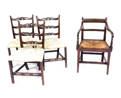 Three Georgian mahogany ladder back dining chairs, with overstuffed serpentine seats in gold damask fabric, raised on square 