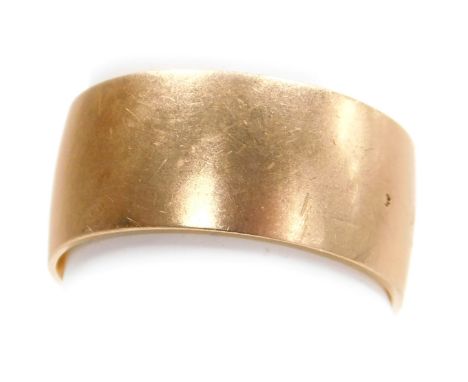 A wide wedding band, of plain form, yellow metal, bears marks, size R½, 8.4g.