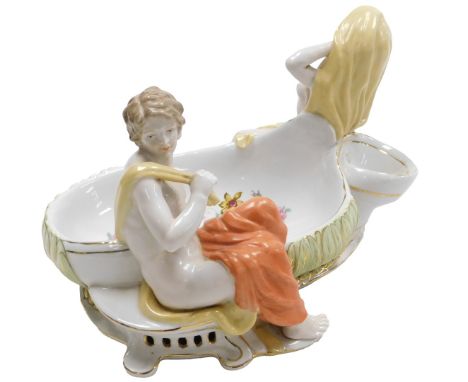 A 20thC Continental porcelain figural dish, printed with flowers and a modelled with a semi clad man and a woman, printed R a