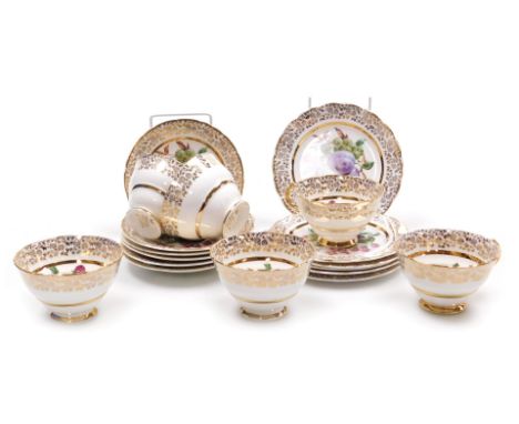 A Lubern porcelain part tea service, printed with fruit within a gilt floral border, printed marks, comprising six cups, sauc