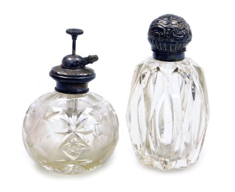 A Victorian cut glass scent bottle, with silver mount and hinged lid, embossed with rococo scrolls, London 1898, together wit