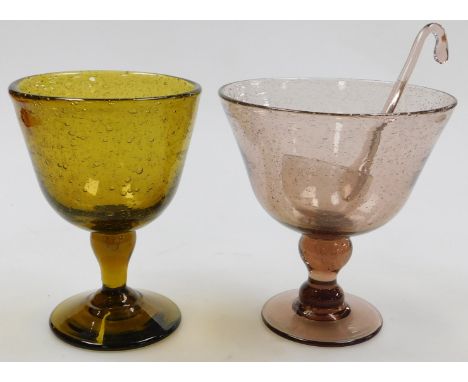 A 20thC Continental amethyst glass punch bowl, with ladle, raised on an hour glass stem, 25cm high, together with an amber gl