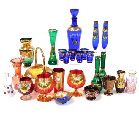 A group of Continental gilt overlaid coloured glassware, enamel decorated with flowers, including brandy balloons, decanter, 