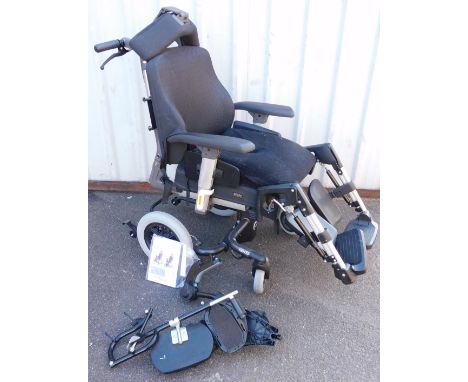 A Breezy manual wheelchair, with adjustable head foot and arm rests, no. 1015098C, with instructions.