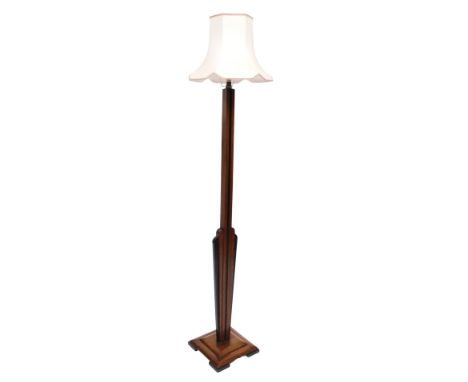 An Art Deco mahogany and ebonised standard lamp, with a white shade, 185cm high.