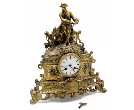 A late 19thC French brass cased mantel clock, circular enamel dial bearing Roman numerals, eight day movement with bell strik