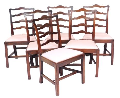 A set of George III mahogany ladder back dining chairs, with pink drop in seats, raised on square legs, comprising six single