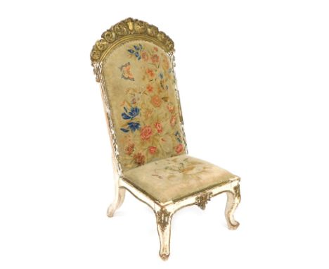 A 19thC Continental gilt wood prie dieu chair, floral and butterfly decorated overstuffed tapestry back and seat, raised on c
