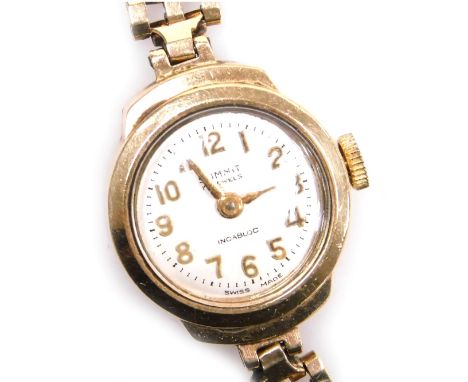 A Summit lady's 9ct gold wristwatch, silvered dial bearing Arabic numerals, seventeen jewelled movement, on a 9ct gold gate l