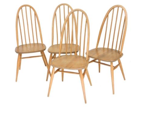 Four Ercol Quaker light elm dining chairs.