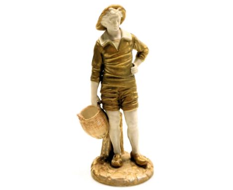 A Royal Worcester blush porcelain figure of a man, c1918, modelled standing in a hat and clogs, holding a basket, raised on a