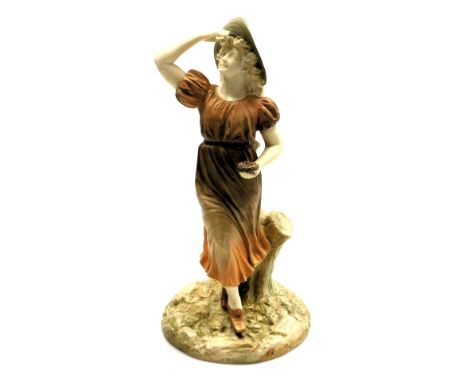 A Hadley's Royal Worcester porcelain figure, c1904, of a lady, looking skywards holding a basket of eggs, incised signature, 