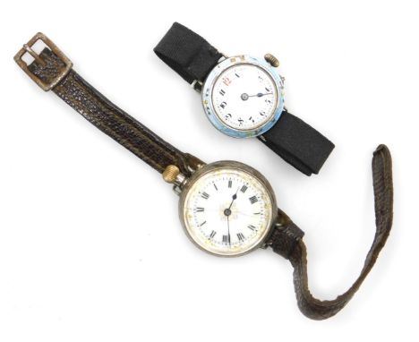 An early 20thC silver cased wristwatch, with a pocket watch winder, circular enamel dial bearing Roman numerals, the case wit