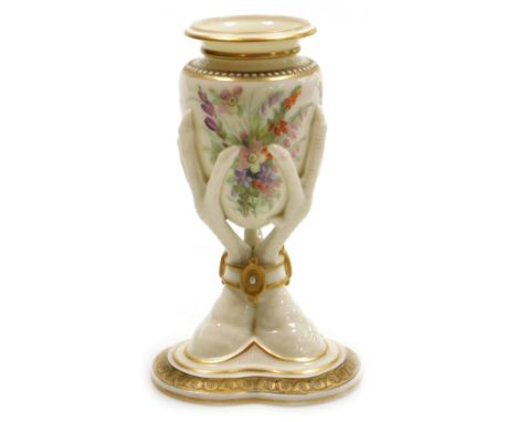 A Royal Worcester porcelain vase, c1868, painted with flowers, raised on a triple bird's claw stem and triform base, printed 