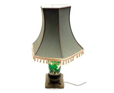 An early 20thC Continental green glass table lamp, gilt decorated with flying geese over bullrushes, raised on a brass base, 