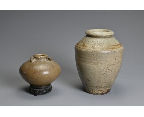 TWO CHINESE CERAMIC ITEMS, YUAN / MING DYNASTY. To include a crackled celadon glazed jar with three looped handles at the sho