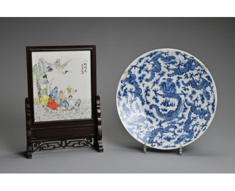 A CHINESE BLUE AND WHITE PORCELAIN DISH TOGETHER WITH AN ALABASTER TILE, 20TH CENTURY. The porcelain dish decorated with nine