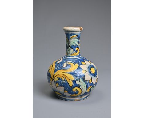 A CALTAGIRONE MAIOLICA BOTTLE-SHAPED VASE, 17-18TH CENTURY. With tall neck, painted overall with flowerheads and scrolling fo