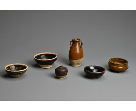 A GROUP OF CHINESE BROWN GLAZED POTTERY ITEMS, SONG / YUAN DYNASTY. To include three tea bowls, two with white rims; A tripod