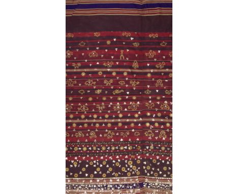 AN INDONESIAN SUMATRAN LAMPUNG CEREMONIAL GOLD THREAD TAPIS SARONG, EARLY 20TH CENTURY.Embroidered with stylised trees, flowe