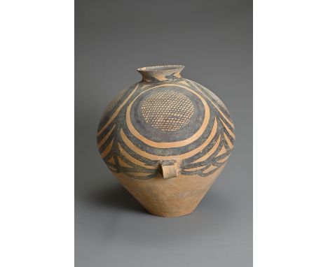 A LARGE CHINESE NEOLITHIC MACHANG PAINTED POTTERY JAR. With two wide lug handles at the waist decorated in red and black pigm