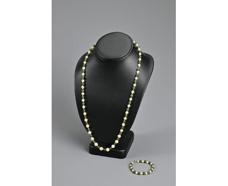 A VINTAGE JADE AND PEARL BEAD NECKLACE. Alternating jade beads with graduating pearls; Together with a smaller strung section