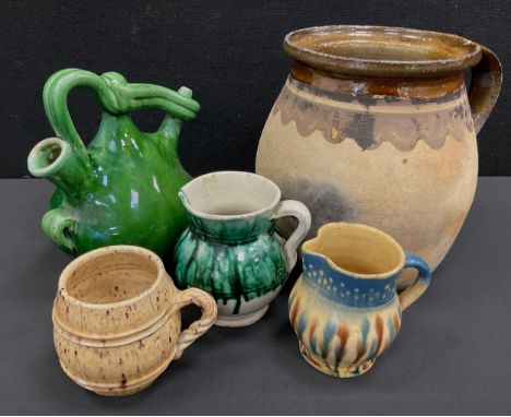 A 19th century French confit jug, a Botijo harvest flask, a late 18th century Sussex slip ware speckled cider jug, c.1790, 19