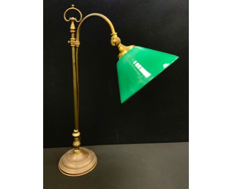 A Quinquet type ‘Watch-maker’s’, or desk lamp, brass stand with rise-and-fall slide, arch-top, green glass shade, 57cm high.
